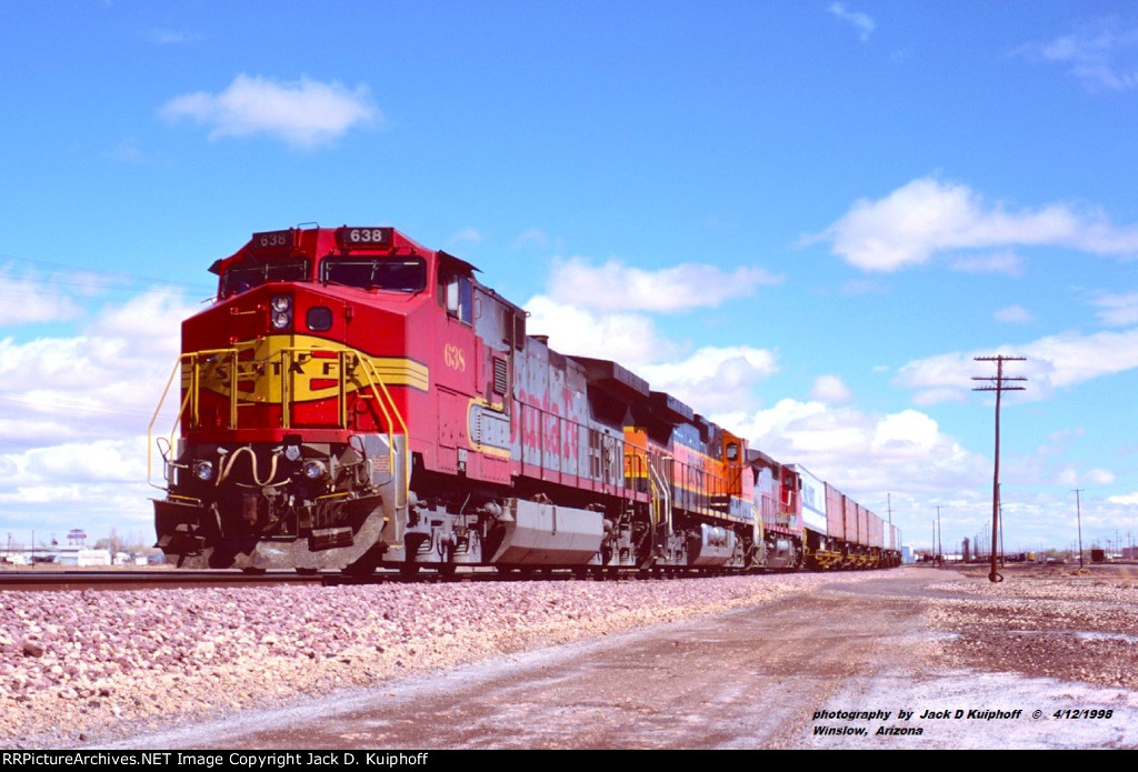 ATSF 638-BNSF 1058-ATSF 902, west bound leaving the yard at West Winslow, Arizona. April 12, 1998.